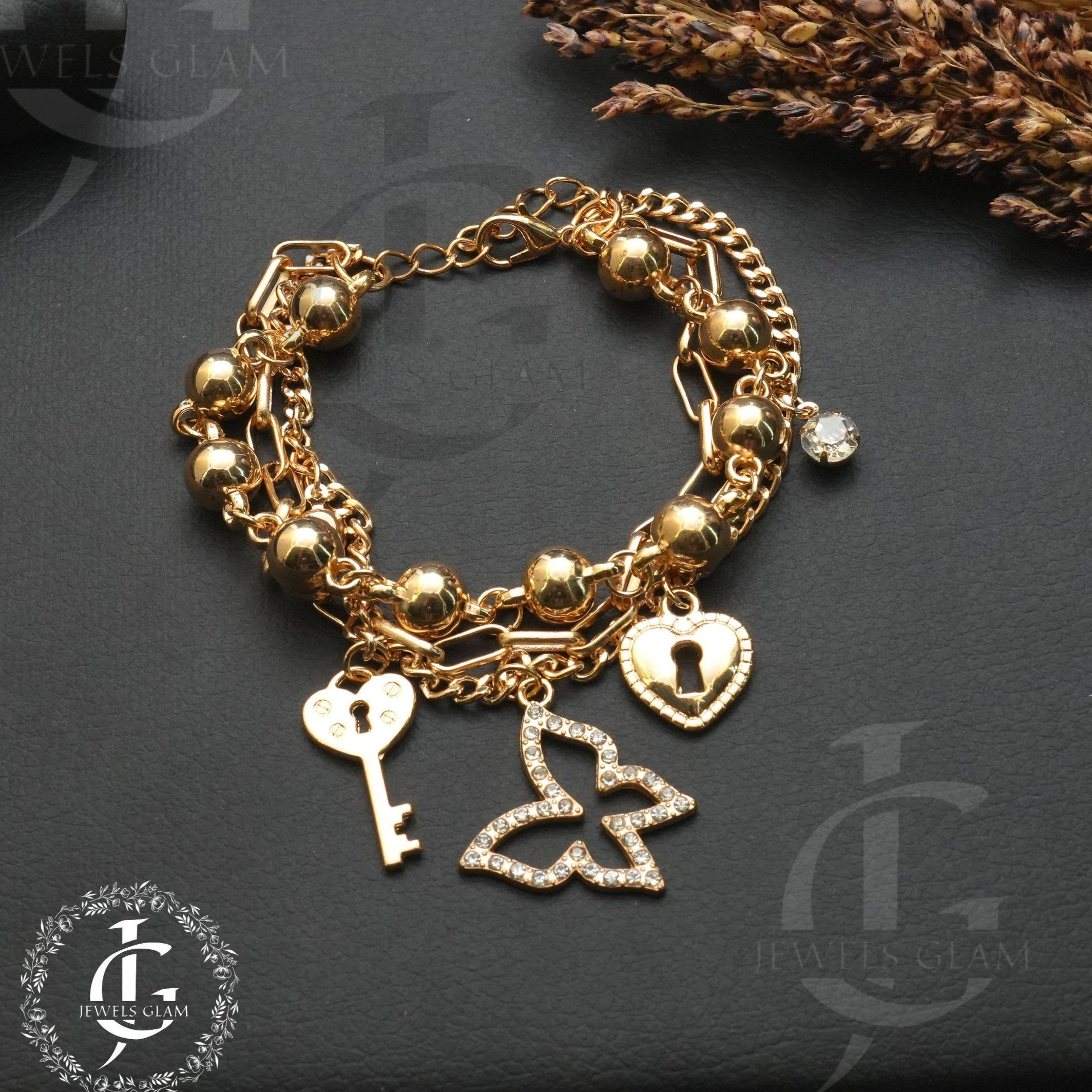 Elegant Charm Link Bracelet with Key and Heart Details