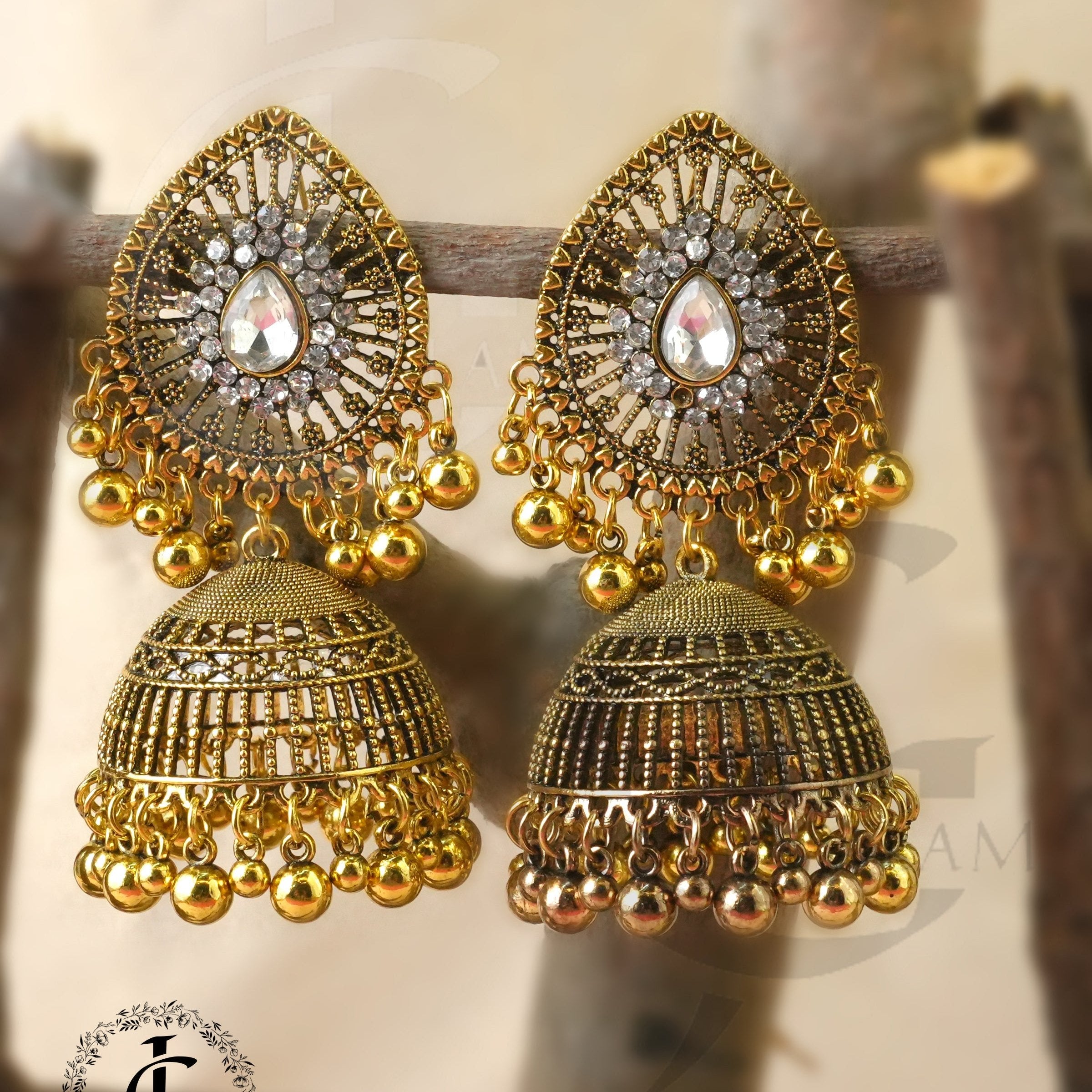 Regal Gold-Plated Teardrop Jhumki Earrings